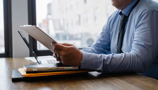 person at a desk analyzing a report